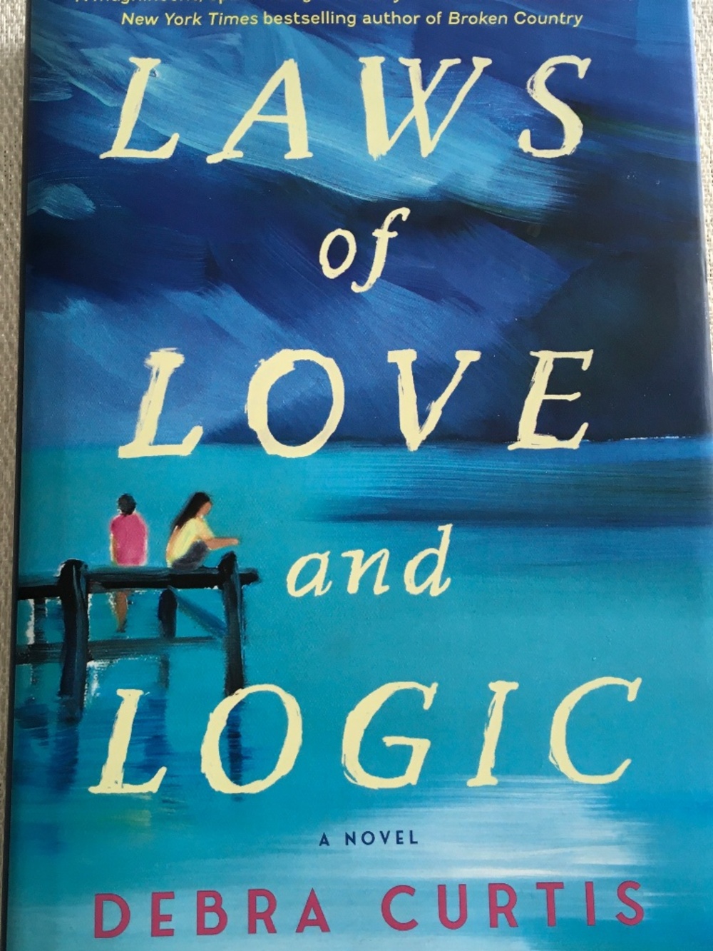 Hardcover copy of Laws of Love and Logic: A Novel by Debra Curtis